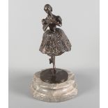 T Merrifield: a bronze sculpture of a ballerina on points, limited edition 55/150, on circular