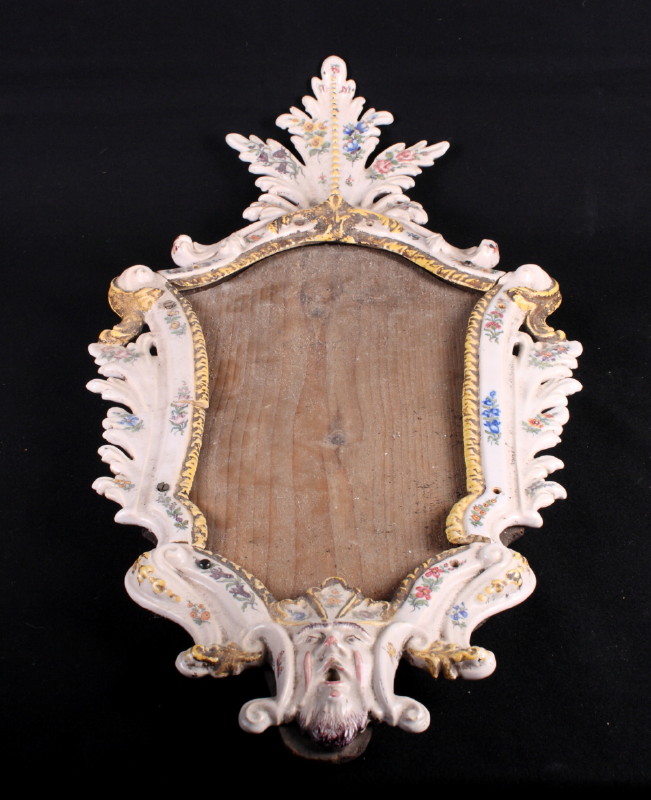 A 19th Century faience pottery mirror frame, 27" high (a/f)