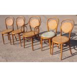 A set of five Dinette light beech framed bentwood dining chairs with caned backs and seats (4+1)