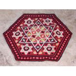 A hexagonal patchwork mat decorated central Star of David design, 38" dia approx