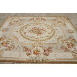 An Aubusson type tapestry carpet of traditional 18th Century design, roses on a light ground, 93"