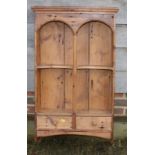 A waxed pine open wall shelf, fitted two drawers with inverse curved shelves, shelves 22" wide