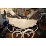 A doll's Silver Cross double pram with two folding hoods and sun shade