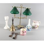 A brass double table lamp with green glass shades, a Sunderland lustre jug and mug, a Royal