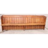 A 19th Century pine pew seat, 103" long