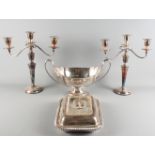 A pair of silver plated two-branch candelabra, an oval plated pedestal fruit bowl and a plated