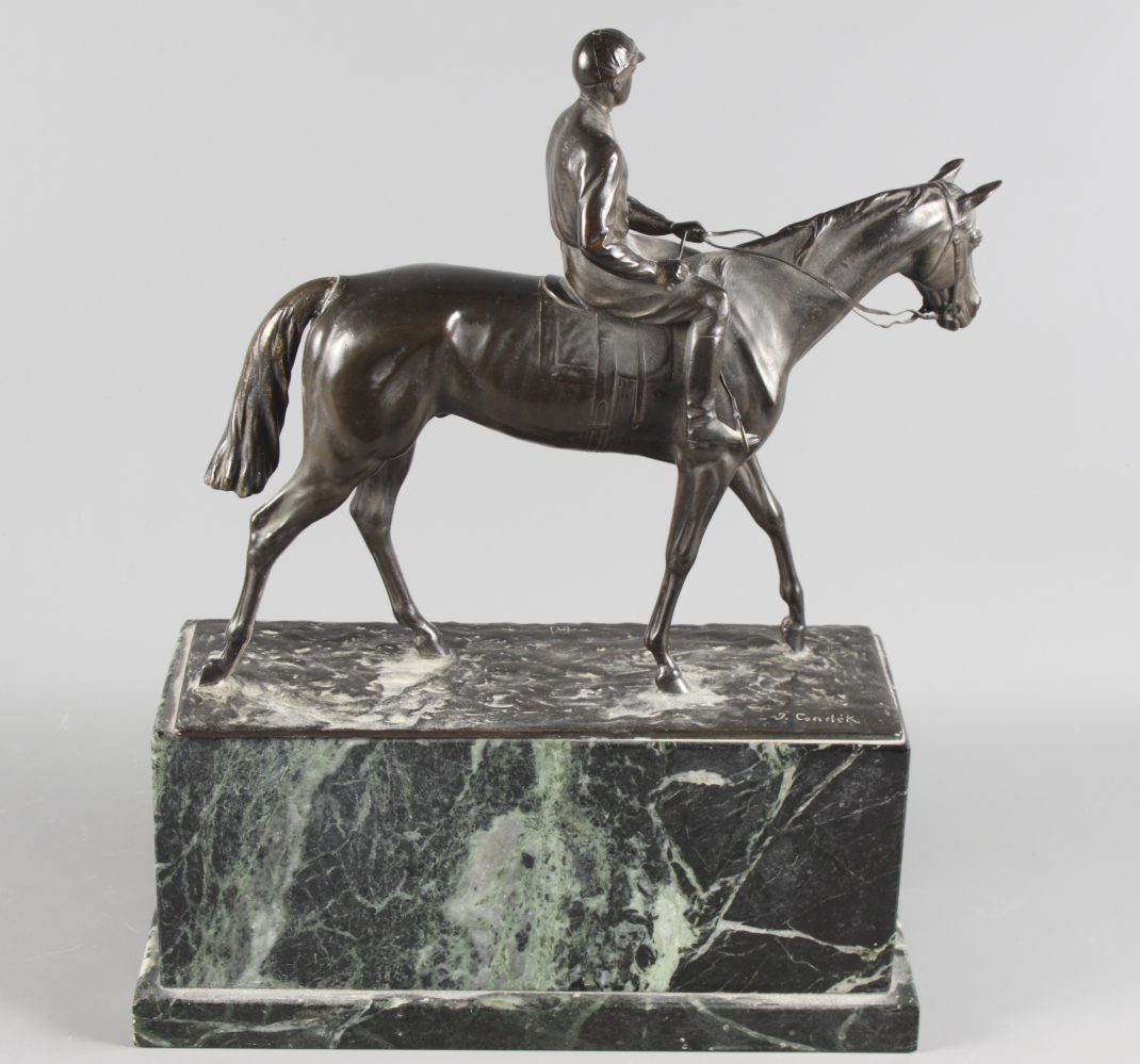 J Csadek: a bronze model of a racehorse with jockey up, on green marble plinth, 12" long - Image 2 of 4