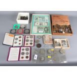 A selection of British and world coins and bank notes including commemorative crowns, etc