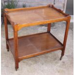 A mahogany rectangular two-tier tray top tea trolley, 30" x 20"