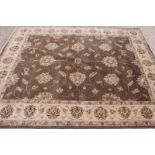 A modern Persian rug decorated tendril design in brown and beige, 98" x 120" approx
