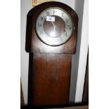 A mid 20th Century oak long case clock