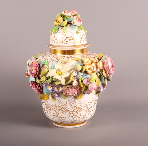 A 19th Century porcelain Stevenson Sharp (Derby) flower encrusted lidded jar with gilt decoration,