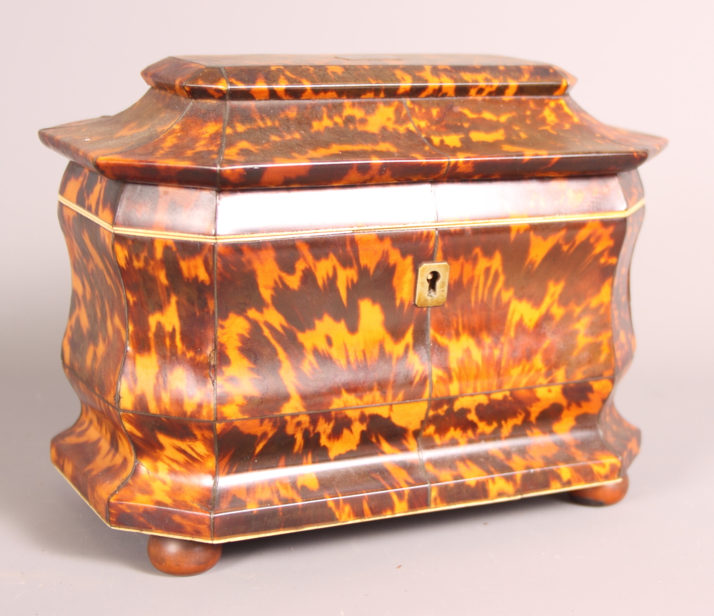 A 19th Century tortoiseshell and ivory two-compartment tea caddy, 8" wide