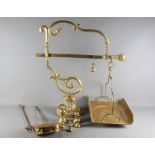 A brass balance, a set of brass weights, a brass chestnut roaster and a brass toasting fork