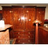 An early 20th Century mahogany and satinwood banded breakfront wardrobe, centre section fitted