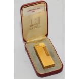 A Dunhill lighter, rolled as gold wash, in original case