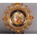 A 19th Century Vienna porcelain plaque, signed Kaufmann, in an Italian style gesso frame, plaque 9