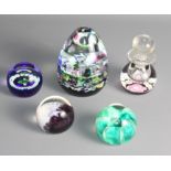 Three Caithness paperweights, "Harlequin", "Miniature Scots Thistle", "Seagems", a similar "Rose"