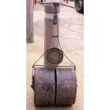 A cast iron garden roller