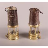 Two miners 19th Century wrought brass and steel lamps, one stamped "RICHARD JOHNSON CLAPHAM MORRIS",