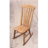 A beech Windsor lath back rocking chair