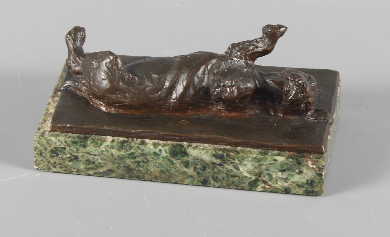 An unsigned bronze sculpture of a dog lying on its back, on green marble base, 5 1/2" x 3", and a - Image 2 of 3