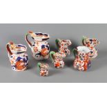 A collection of seven 19th Century ironstone Imari decorated jugs, various (some damages)