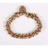 An Edwardian 9ct rose gold curb link bracelet with engraved decoration and heart shaped clasp, 19.9g