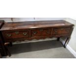 An 18th Century oak dresser, the base fitted three mahogany crossbanded drawers, on cabriole