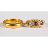 An 18ct gold, diamond and ruby dress ring (one stone missing), 4g approx, and a 22ct gold wedding