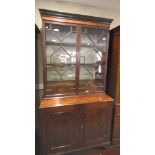 An early 19th Century mahogany and Kingwood banded bookcase, the upper section fitted nest of ten