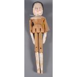 A 19th Century carved and painted articulated wood doll, 10" high