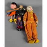 A Norah Wellings clown doll in orange suit, two other smaller dolls and a Magic Roundabout "