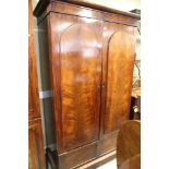 A Victorian mahogany hall wardrobe enclosed two panelled doors, on plinth base, 41" wide x 79" high