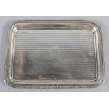 A silver dressing table tray with engine turned decoration and Greek key border, 14.5oz troy approx