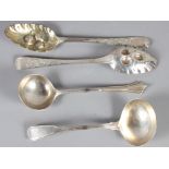 A pair of Georgian silver berry spoons and two silver sauce ladles, 8.3oz troy approx