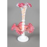 A Victorian pink and white glass table centre with frilled edges and floral enamelled decoration,