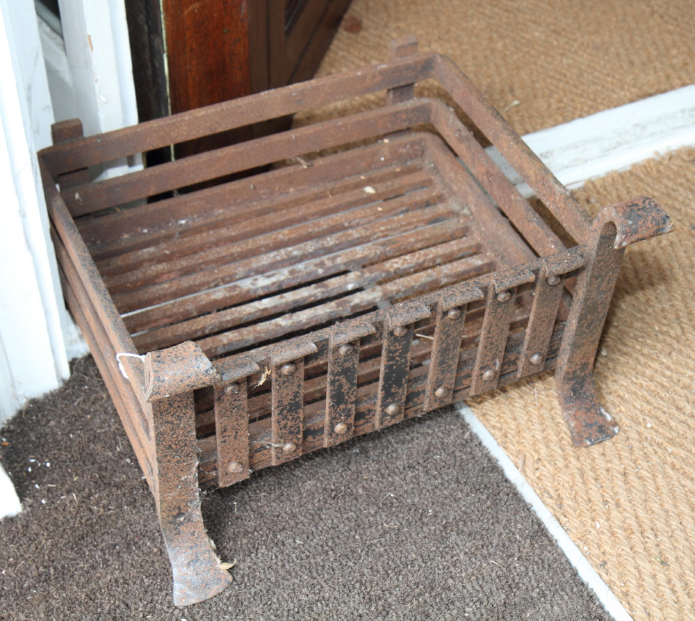 A wrought iron fire basket