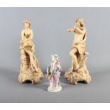 A pair of 19th Century porcelain figures, lady and gentleman, one playing a flute the other a