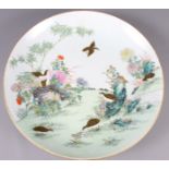 A Chinese porcelain famille verte charger with quail decoration, 15" dia