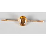 A late Victorian/Edwardian Scottish provincial 15ct gold bar brooch set single cairngorm, by William