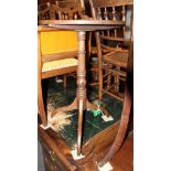 An 19th Century mahogany circular table, on turned column and three balloon splayed supports, 17"