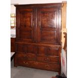 An 18th Century press cupboard enclosed two doors over two short and one long drawer, on stile