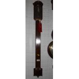 A George III mahogany stick barometer with moulded arch top, brass dial engraved Fraser London, on