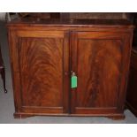 A 19th Century hall cupboard enclosed two doors with figured panels, on bracket supports, 46 1/2"