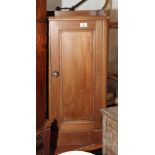 A 19th Century mahogany bedside cabinet enclosed panelled door