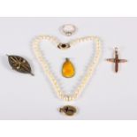 A graduated pearl necklace with 9ct gold gem set clasp, a gilt metal gem set crucifix pendant, an