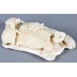 A 19th Century Japanese Meiji period carved ivory okimono, formed as a turtle and four young on a