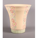 A Crown Devon pottery trumpet vase decorated carved panels of flowers, indistinctly signed to