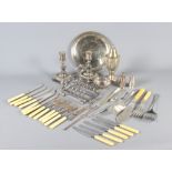A pair of George II style silver plated candlesticks, a plate fish server, a plated sugar dredger,